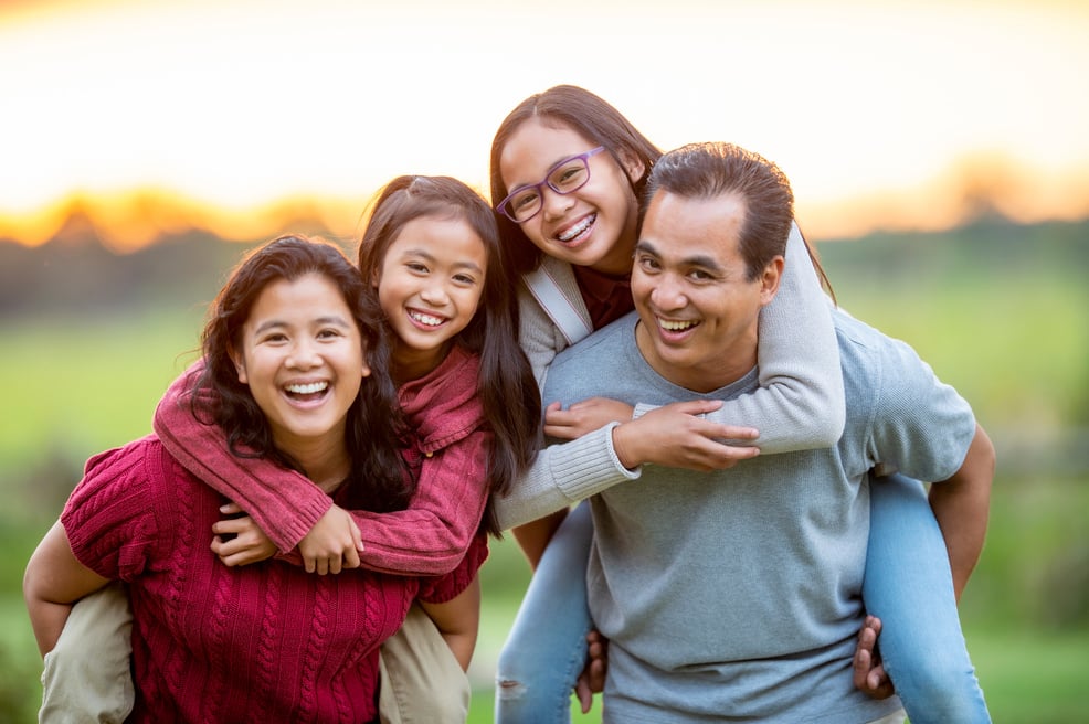 Filipino Family Piggyback Portrait Outside stock photo